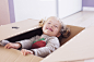 Little girl playing in cardboard box, portrait by photoalto on 500px