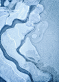 An aerial view of a river in the snow