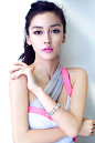 Angelababy - bright pink w/ a tan and a slightly messy pony.