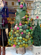 Yes, that's a Christmas tree-- covered in yarn balls and little birdies.  Apparently this was an Anthropologie window display last year.  Love it!
