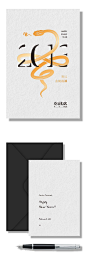 This may contain: two envelopes, one with a pen and the other with an image of letters on it
