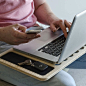 SlateGo Mobile LapDesk : The SlateGo is chiseled from a sheet of pure, premium bamboo. It's ultra lightweight, super strong, and it will absorb the heat from your laptop. The curves and air ventilation are cut, hand-sanded, and polished to mirror the feel