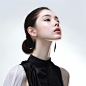 A_girl_wearing_a_black_suspender_with_her_head_slightly_til_f8bfde6d-a715-465b-9e84-538605e8e577