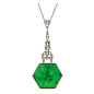 Art Deco emerald and diamond pendant. Circa 1935.... A platinum pendant necklace set with one central hexagonal emerald carved with a Mogul style florette in a collet setting suspended from an openwork articulated geometric pendant set with one central re