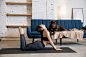 Free photo friends. young woman working out at home , doing yoga exercises with the dog. beautiful woman stretching, practicing. wellness, wellbeing, healthcare, mental health, lifestyle concept.