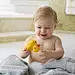 Caucasian baby boy playing with rubber duck