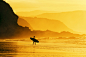 surfer entering water at misty sunset by Mikel Martinez de Osaba on 500px