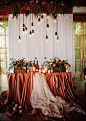 27 Cool Sweetheart Wedding Table Backdrops To Try: a white curtain backdrop, overhead blooms and bulbs for a fall wedding #weddingtables; #weddingbackdrop; #brideandgroom; #weddingreception