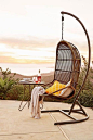 How gorgeous is this outdoor reading chair? This would add a touch of modern style to ay patio -- and create a tranquil reading nook!