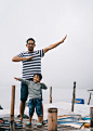 Man and Boy Standing on Bridge