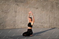 Full shot woman stretching on mat