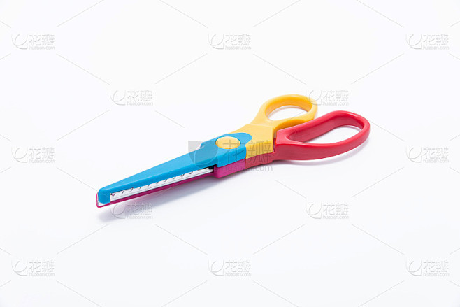 Colorful scissors on white background.