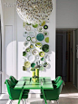 High-Floor Heaven: Ghislaine Viñas and David Hotson's Whimsical Downtown Penthouse | The breakfast area’s Mike & Maaike table, Eero Saarinen chairs, Tim Fishlock chandelier, and ceramic-plate installation by Viñas. #design #interiordesign #interiordes