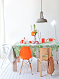 Orange Eames Chair + Green Tablecloth