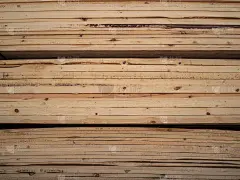 Heap of wooden boards in sawmill or in a warehouse