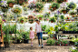 Mother and daughter shopping in plant nursery greenhouse by Hero Images on 500px