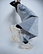 Photo by   on June 12, 2023. May be an image of overcoat, sneakers, raincoat, sportswear, parka and text.