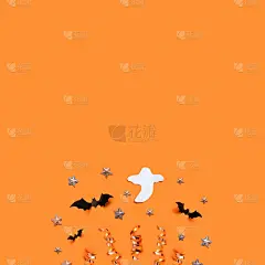 万圣节假日背景与蝙蝠，星星和装饰在一个橙色的板。