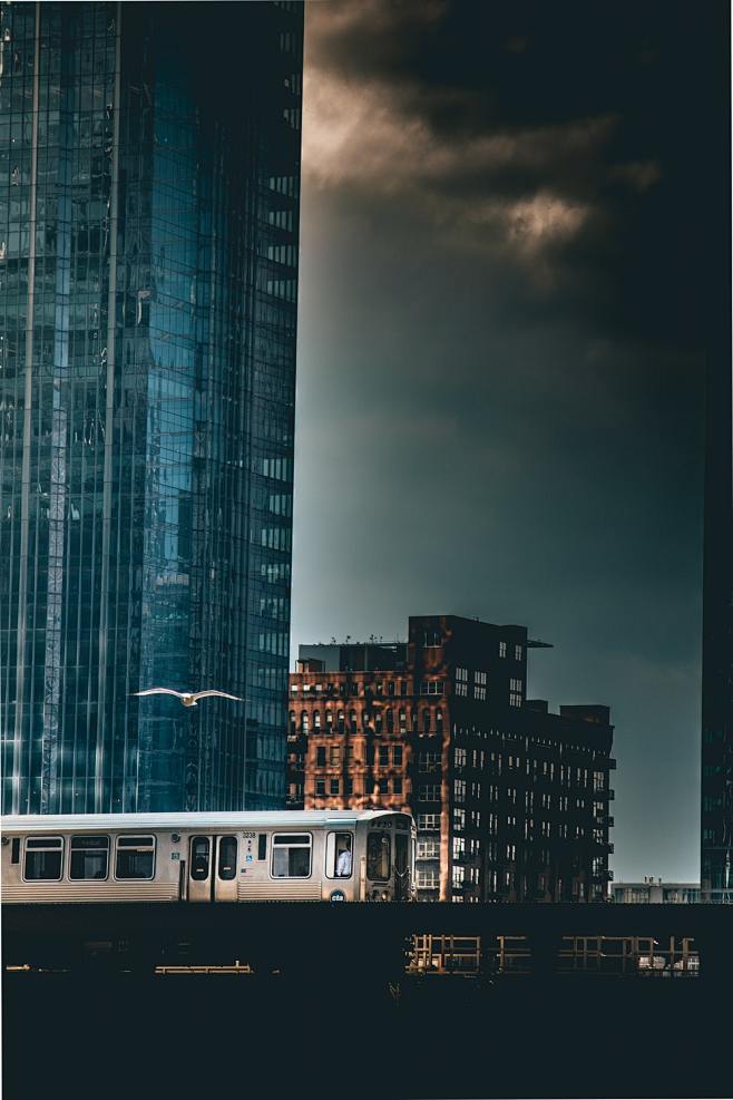 gray train passing b...