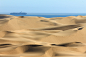 Big sand dunes. Ocean with ships and boat in background. by Dre Picter on 500px
