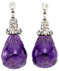 A Pair Of Antique Carved Amethyst And Diamond Earrings.    Ccirca 1890.  A pair of antique amethyst and diamond earrings, each earring with a carved amethyst drop suspended from a pave rose-cut diamond cupola drop and single collet top, mounted in silver 