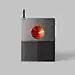 This may contain: an electronic device with a red light on the front and back side, sitting on a gray surface