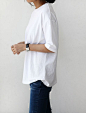 What's my go to outfit? Simple. White t-shirt with a plain pair of jeans.: 