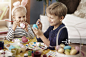 Little kids painting Easter eggs. Debica, Poland
