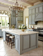 Gray cabinets, marble, coffered ceiling, window treatment...