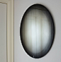 Fading mirror in black. 'fading mirror' consists of a printed gradient placed between the glass and the silver reflective layer. the black and white fades   create a frame for the reflected images.