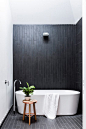 A lightwell illuminates the moody charcoal tiles in this bathroom within a [renovated 1940s home](http://www.homestolove.com.au/1940s-facade-hides-a-sizzling-21st-century-home-3269|target="_blank"). *Photo: Maree Homer* Tap the link now to see w