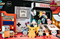 This may contain: some paper toys that are on display in front of a game machine and other items