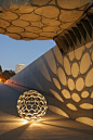 Illuminated Mass. Tiny moon shines on Levitated Mass at LACMA Los Angeles. Sculpture and photograph by Maurice Connolly.: 