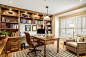 Example of a large classic built-in desk medium tone wood floor home office library design in Orange County with beige walls and no fireplace