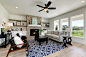 Example of a transitional formal and open concept light wood floor and beige floor living room design in Boise with white walls, a standard fireplace and a metal fireplace