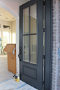 Door painted in Benjamin Moore Wrought Iron. One of the best dark door and trim colors.: 