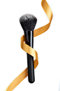 Close-Up Of Make-Up Brush And Ribbon Over White Background