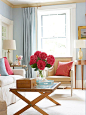 Update a traditional space with soft blue and deep pink accents: 