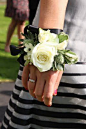 Wrist corsages for the bridesmaids and flower girls. I like this idea because after the ceremony, the bridesmaids don't really carry the bouquets..