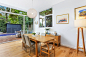 Dining room - modern medium tone wood floor and brown floor dining room idea in Sydney with white walls and no fireplace