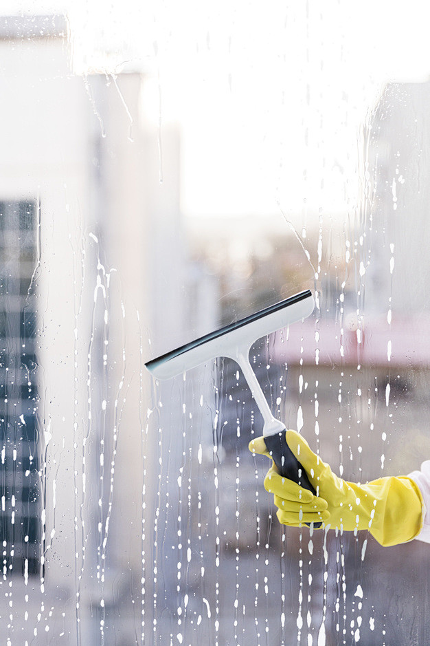 Man cleaning window ...