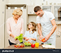 stock-photo-food-family-hapiness-and-people-concept-happy-family-making-dinner-in-kitchen-167775281