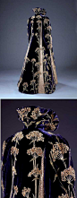 Purple velvet coat, 1895-1900. Medieval-style collar. Entirely covered with dramatic sprays of an English wildflower called Sweet Cicely that are hand-embroidered in yellow and green silk, with petals of white felt. The influence of the Arts and Crafts mo