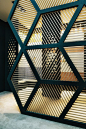 Interesting interior metal with black framed wall. The panes and pattern resembles a geodesic dome design from Buckminster. Fuller RC13 on Behance