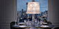 table with Baccarat tableware and chandelier