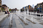 Close up of plaza fountain showing linear grills: