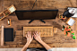 Businesswoman Using Wooden Keyboard On Office Desk