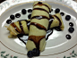 Crepes filled with brownies that I drizzled some homemade chocolate syrup on.