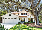 Country white two-story wood gable roof idea in San Francisco