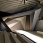 Neil Barrett scenography by AquiliAlberg - Dezeen : Italian studio AquiliAlberg created angular scenography for fashion designer Neil Barrett's catwalk show in Milan last week. Models appeared through an angular tunnel that extended out to form a backdrop